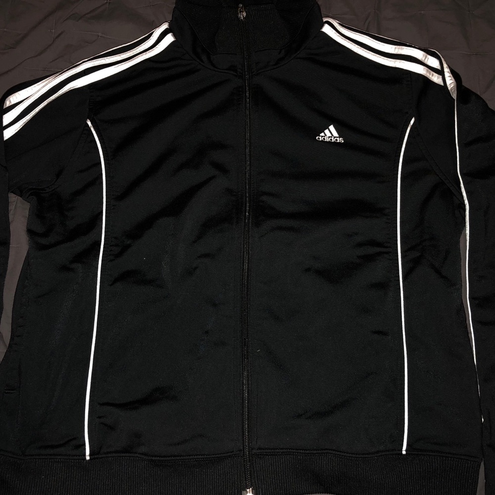 Adidas track jacket. Small but could fit a medium